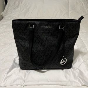 Black Michael KORS MK print leather bag.